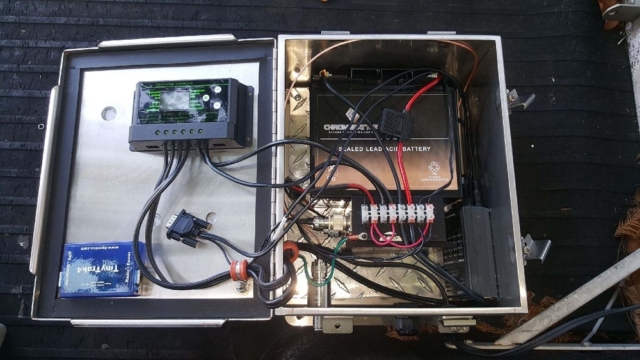 APRS System. FRom Left to Right  Tiny Trak4 (Brains), Solar Charge Controller, 8Ah Lead Acid Battery, Antenna Connector, Power Distribution Block, Radio